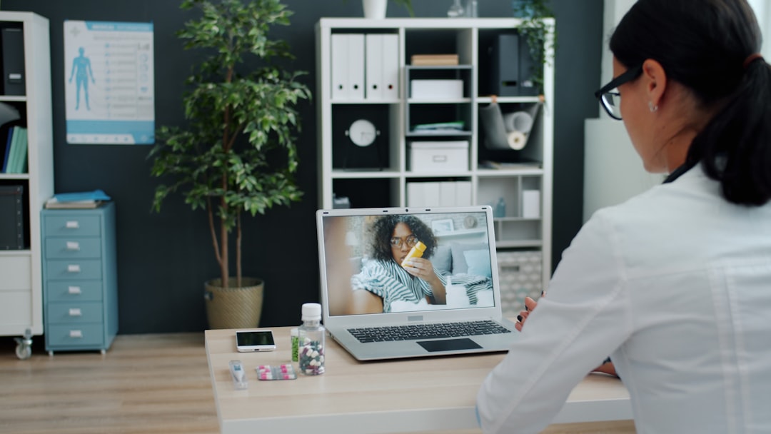 Healthcare professional using a laptop for a digital consultation