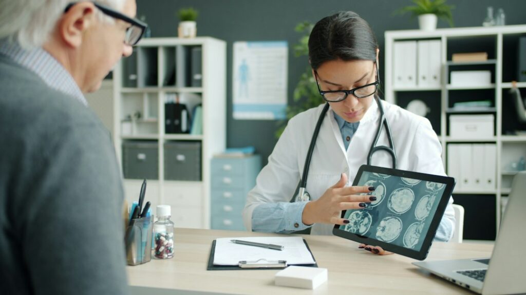 Doctor and patient reviewing medical information together