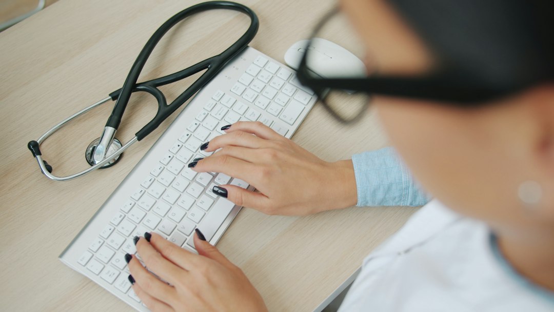 Healthcare professional reviewing digital medical information